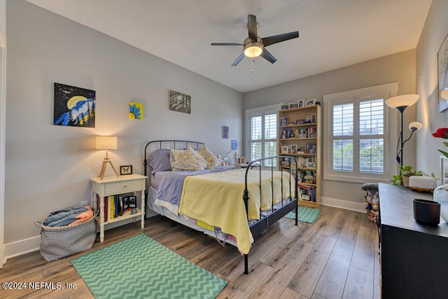 bedroom with hardwood / wood-style floors and ceiling fan