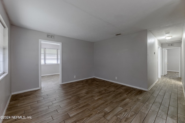 spare room featuring hardwood / wood-style flooring