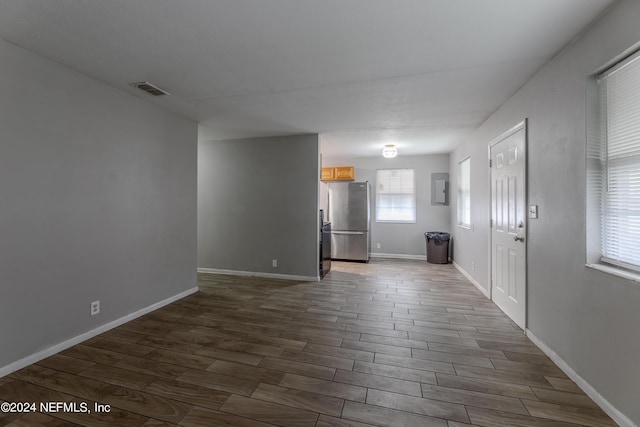 1340 W 11th St, Jacksonville, FL 32209 - unfurnished room featuring baseboards, visible vents, wood tiled floor, and electric panel