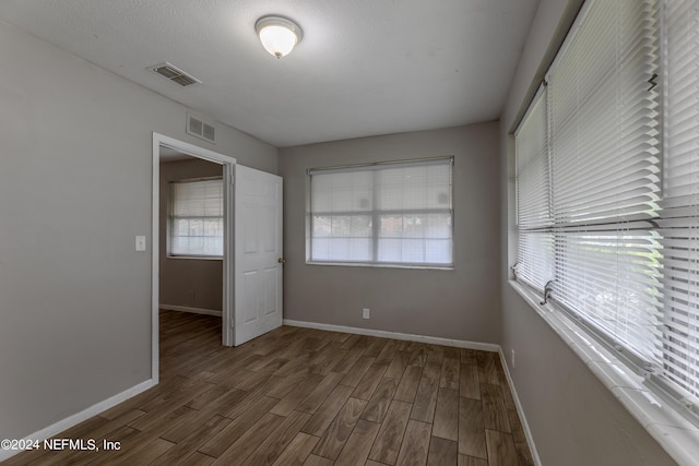 1340 W 11th St, Jacksonville, FL 32209 - spare room with baseboards, visible vents, and wood finished floors