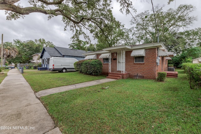1340 W 11th St, Jacksonville, FL 32209 - view of front of house featuring brick siding and a front lawn