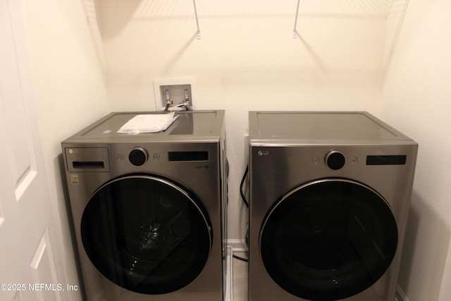 laundry area with washing machine and dryer