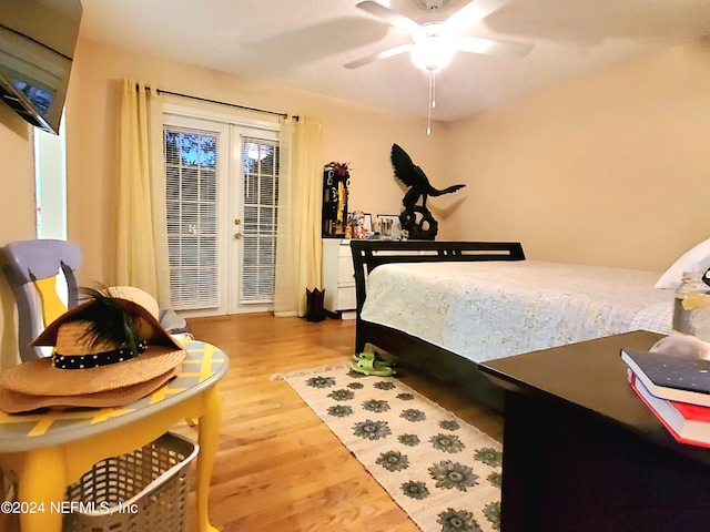 bedroom with ceiling fan and hardwood / wood-style flooring