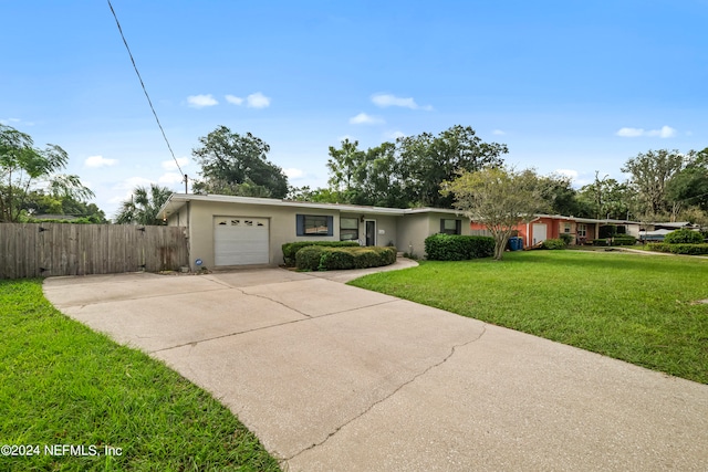 ranch-style house with a front lawn and a garage