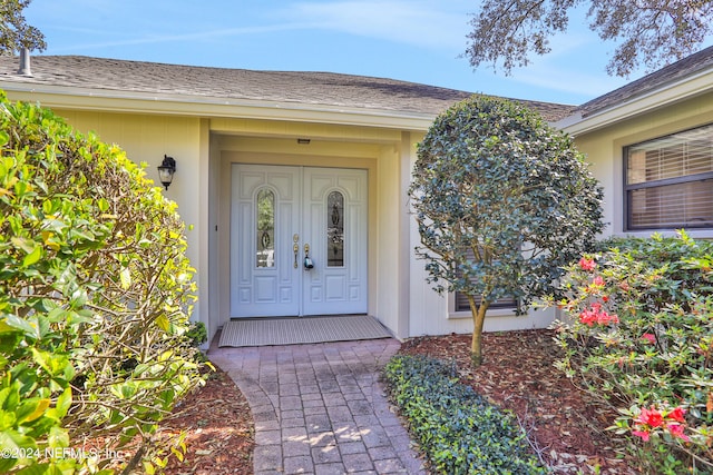 doorway to property featuring a porch