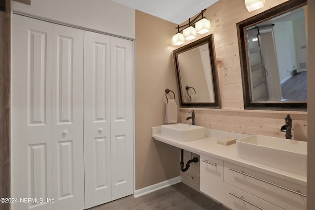 bathroom featuring vanity and hardwood / wood-style flooring