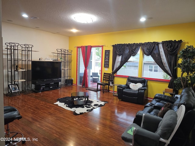 1075 Wetland Ridge Cir, Middleburg, FL 32068 - living room featuring visible vents, a textured ceiling, and wood finished floors