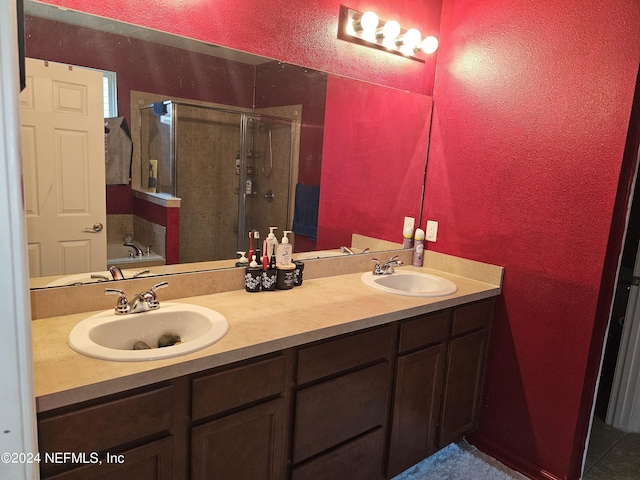 1075 Wetland Ridge Cir, Middleburg, FL 32068 - full bathroom with a stall shower, double vanity, a textured wall, and a sink
