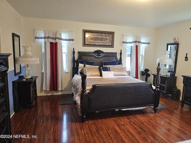 1075 Wetland Ridge Cir, Middleburg, FL 32068 - bedroom with wood finished floors and a textured ceiling