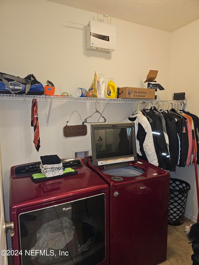 washroom with light tile patterned flooring and separate washer and dryer