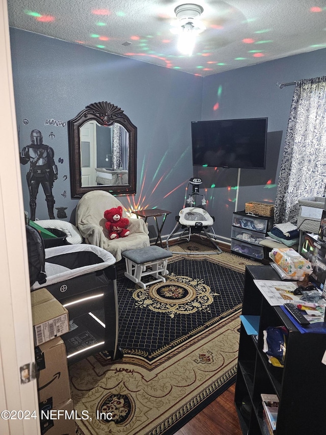 1075 Wetland Ridge Cir, Middleburg, FL 32068 - bedroom with a textured ceiling and wood finished floors