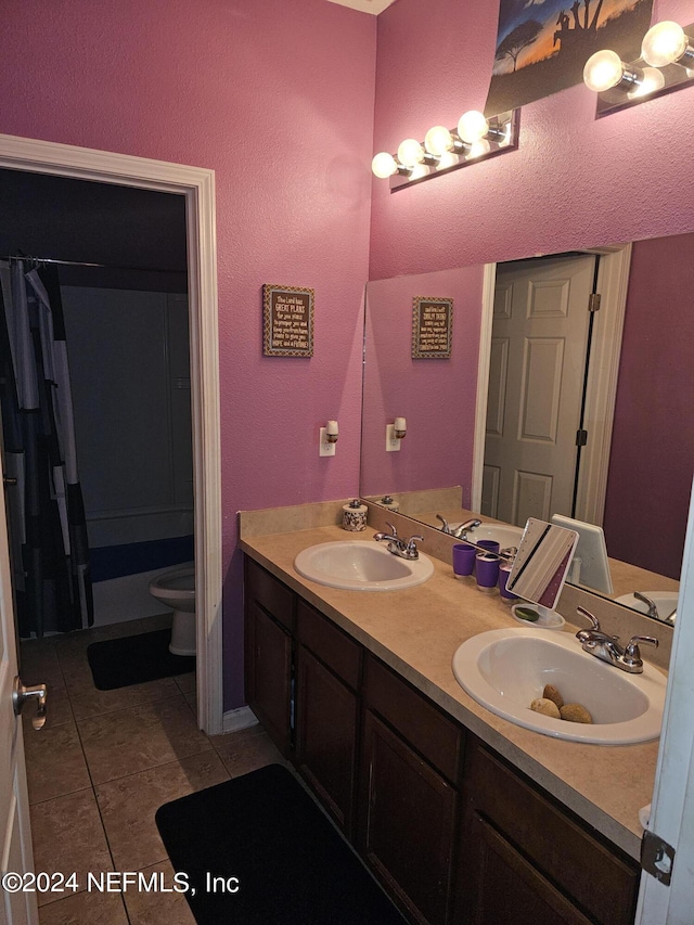 1075 Wetland Ridge Cir, Middleburg, FL 32068 - full bath with toilet, a sink, double vanity, and tile patterned flooring
