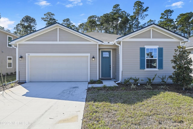 ranch-style home with an attached garage, driveway, and a front yard