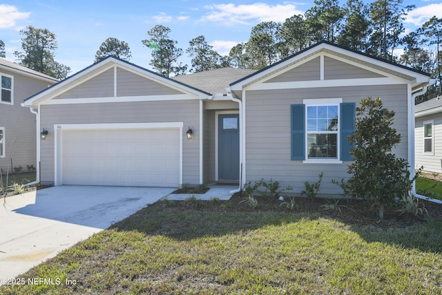 ranch-style house featuring a garage, concrete driveway, and a front lawn