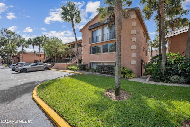 5375 Ortega Farms Blvd Unit 506, Jacksonville, FL 32210 - view of building exterior with uncovered parking