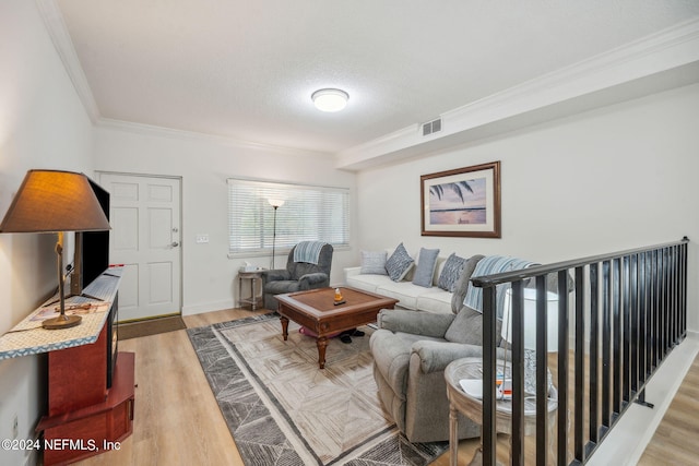 5375 Ortega Farms Blvd Unit 506, Jacksonville, FL 32210 - living room featuring crown molding, visible vents, and light wood-type flooring