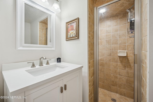 bathroom with vanity and an enclosed shower