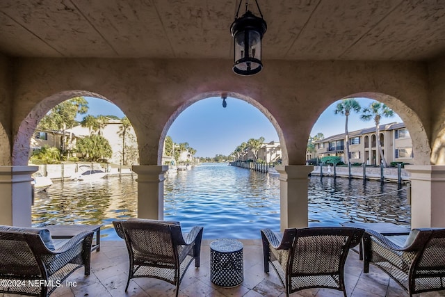 view of dock with a water view and outdoor lounge area