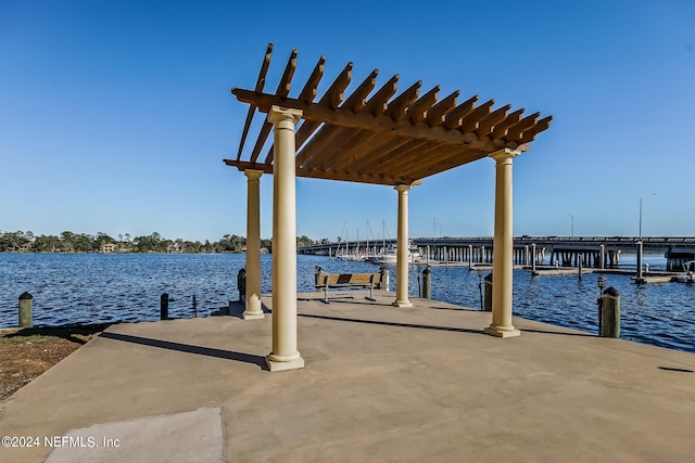 view of dock featuring a pergola and a water view