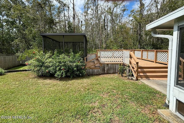 view of yard with a wooden deck