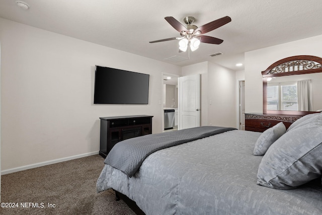 bedroom featuring ceiling fan, a textured ceiling, and carpet