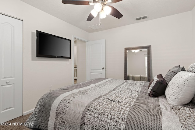 bedroom with carpet flooring, ceiling fan, and a closet