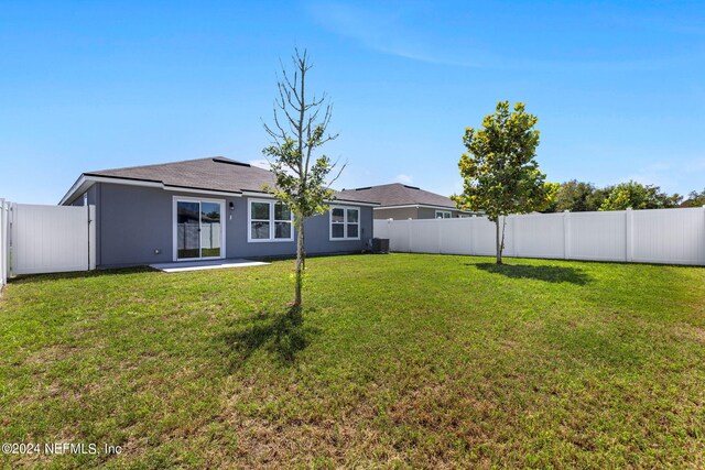 view of yard featuring a patio and cooling unit