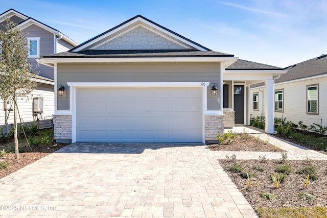 craftsman house with a garage