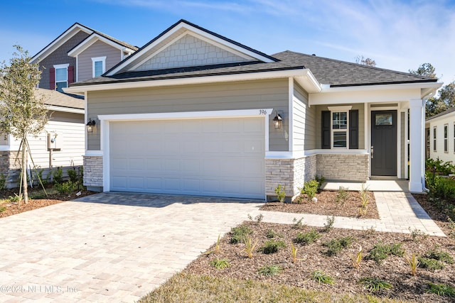 craftsman house with a garage