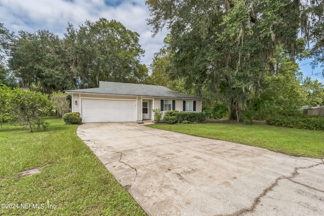 single story home with a garage and a front yard