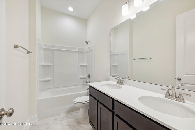 full bathroom with bathing tub / shower combination, vanity, and toilet