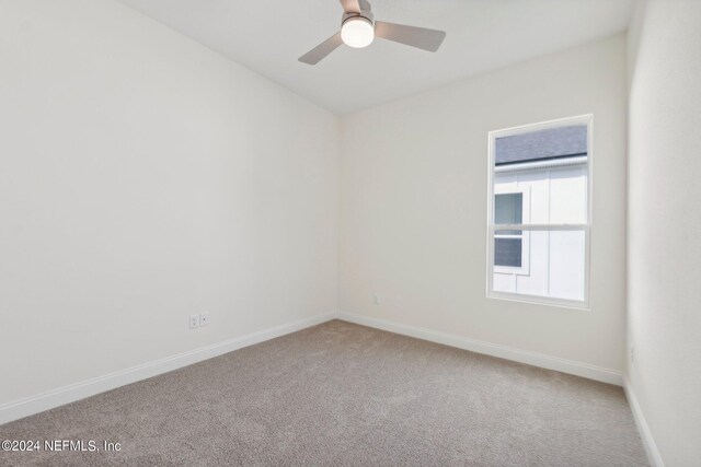 carpeted empty room with ceiling fan