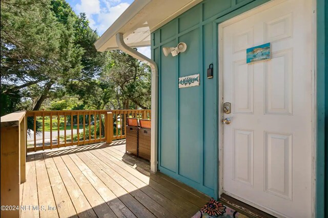 entrance to property with a wooden deck