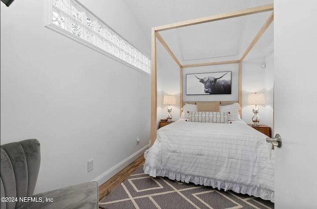 bedroom featuring dark hardwood / wood-style flooring