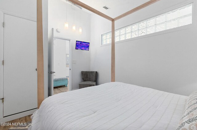 bedroom with hardwood / wood-style floors