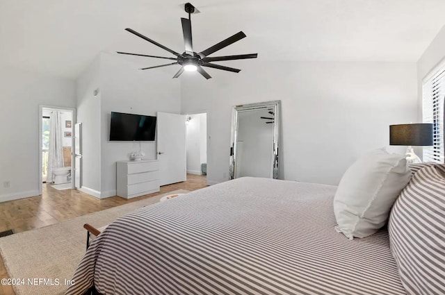 bedroom with light hardwood / wood-style floors, multiple windows, ceiling fan, and ensuite bathroom