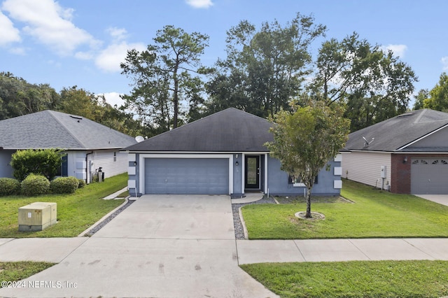 ranch-style home featuring a garage and a front yard