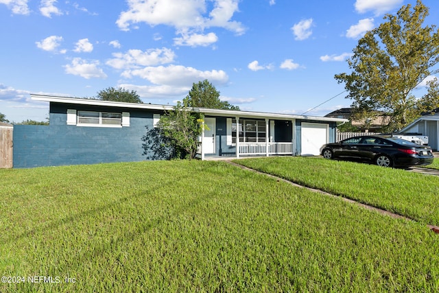 single story home featuring a garage, a porch, and a front yard