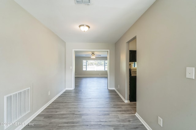 hall with light hardwood / wood-style floors