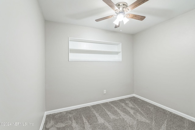 spare room featuring ceiling fan and carpet floors