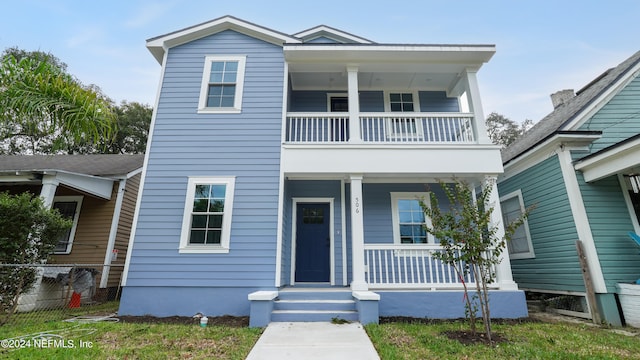 view of front facade with a balcony and covered porch