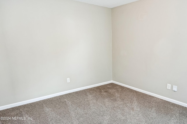 empty room with carpet flooring