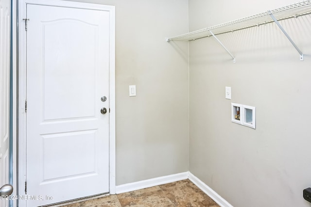 clothes washing area featuring hookup for a washing machine