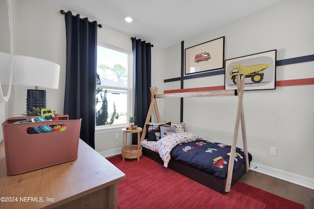 bedroom with wood-type flooring