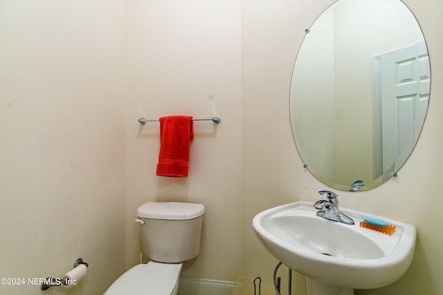 bathroom with sink and toilet