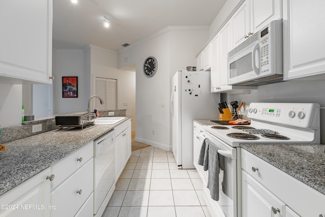 kitchen featuring white cabinets, white appliances, sink, crown molding, and light tile patterned floors