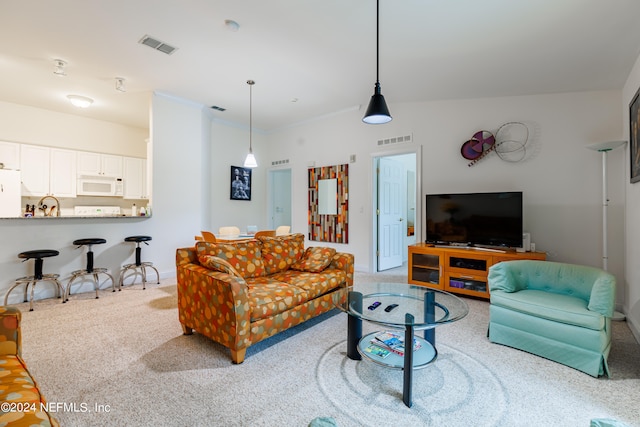 living room featuring light carpet