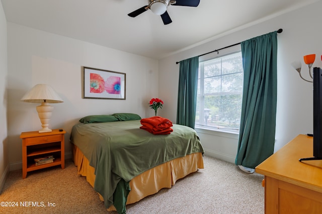 carpeted bedroom featuring ceiling fan