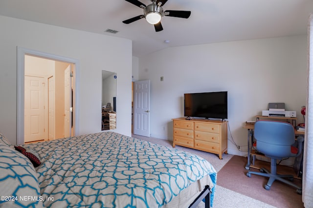 carpeted bedroom with ceiling fan and lofted ceiling