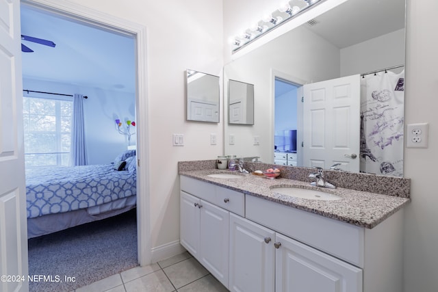 bathroom with ceiling fan, vanity, and tile patterned floors